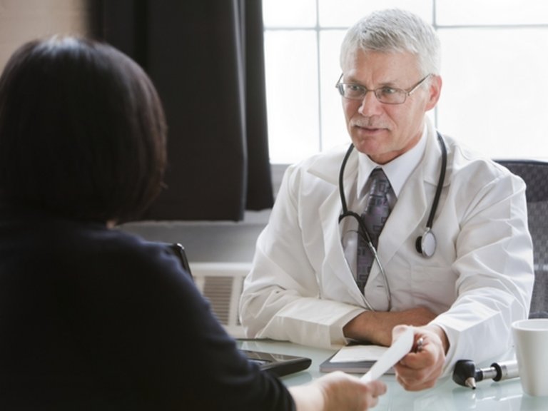 Male doctor talking to a patient