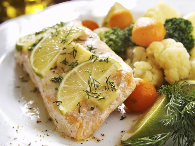 Salmon with lemon herb crust with spring vegetables in herb cream with rice