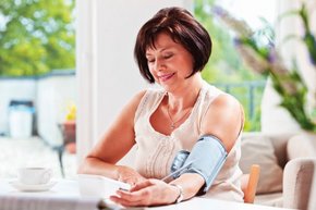 woman taking her blood pressure