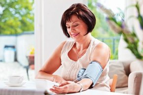 woman taking her blood pressure